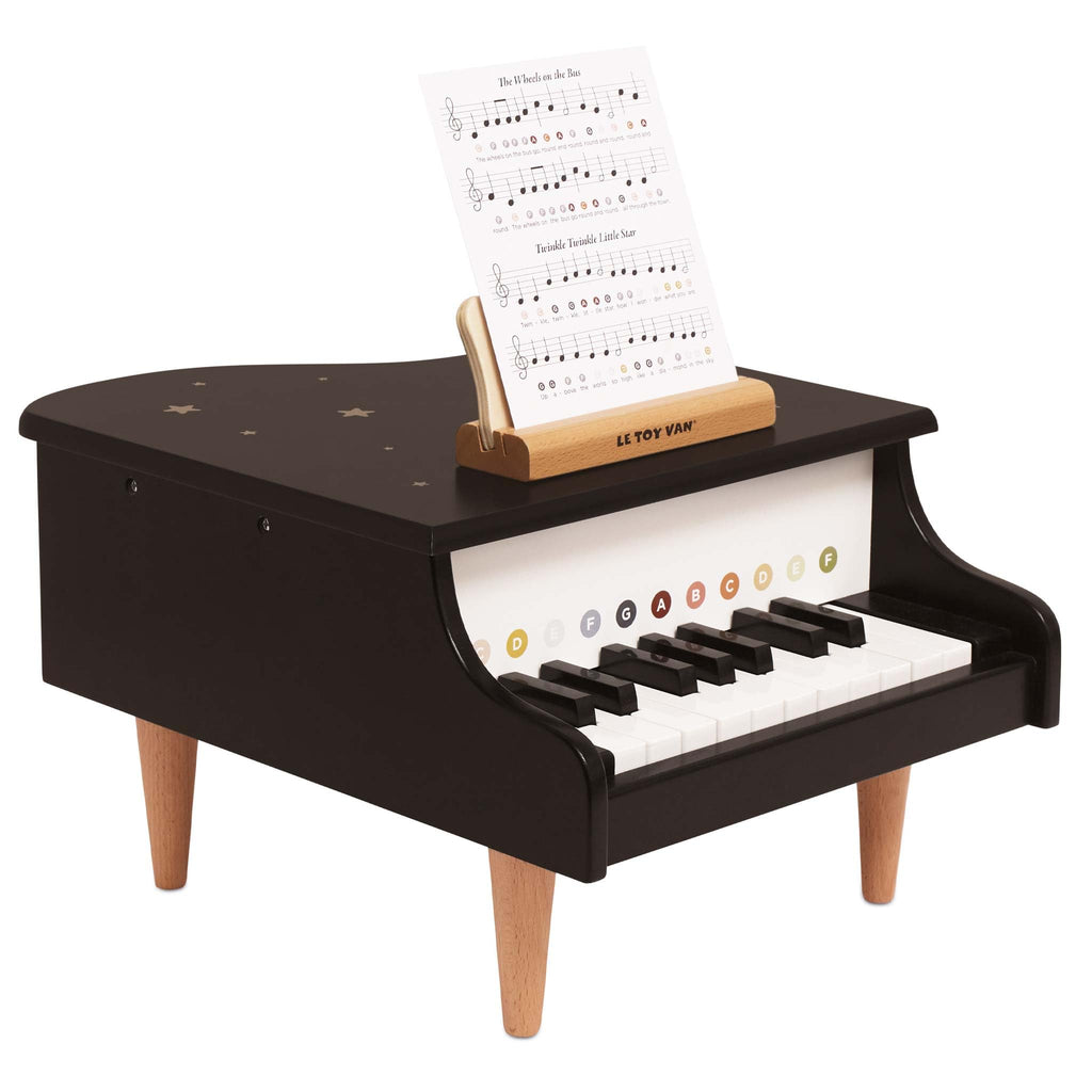 Wooden Grand Piano with Music Sheets